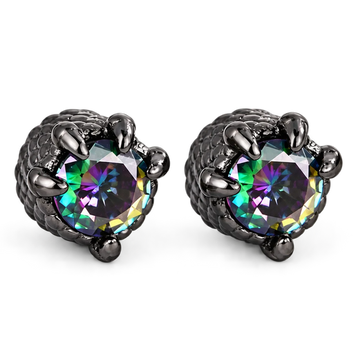 A pair of black claw stud earrings featuring round faceted iridescent gemstones that shift between green, purple, and blue, set in a textured black metal.