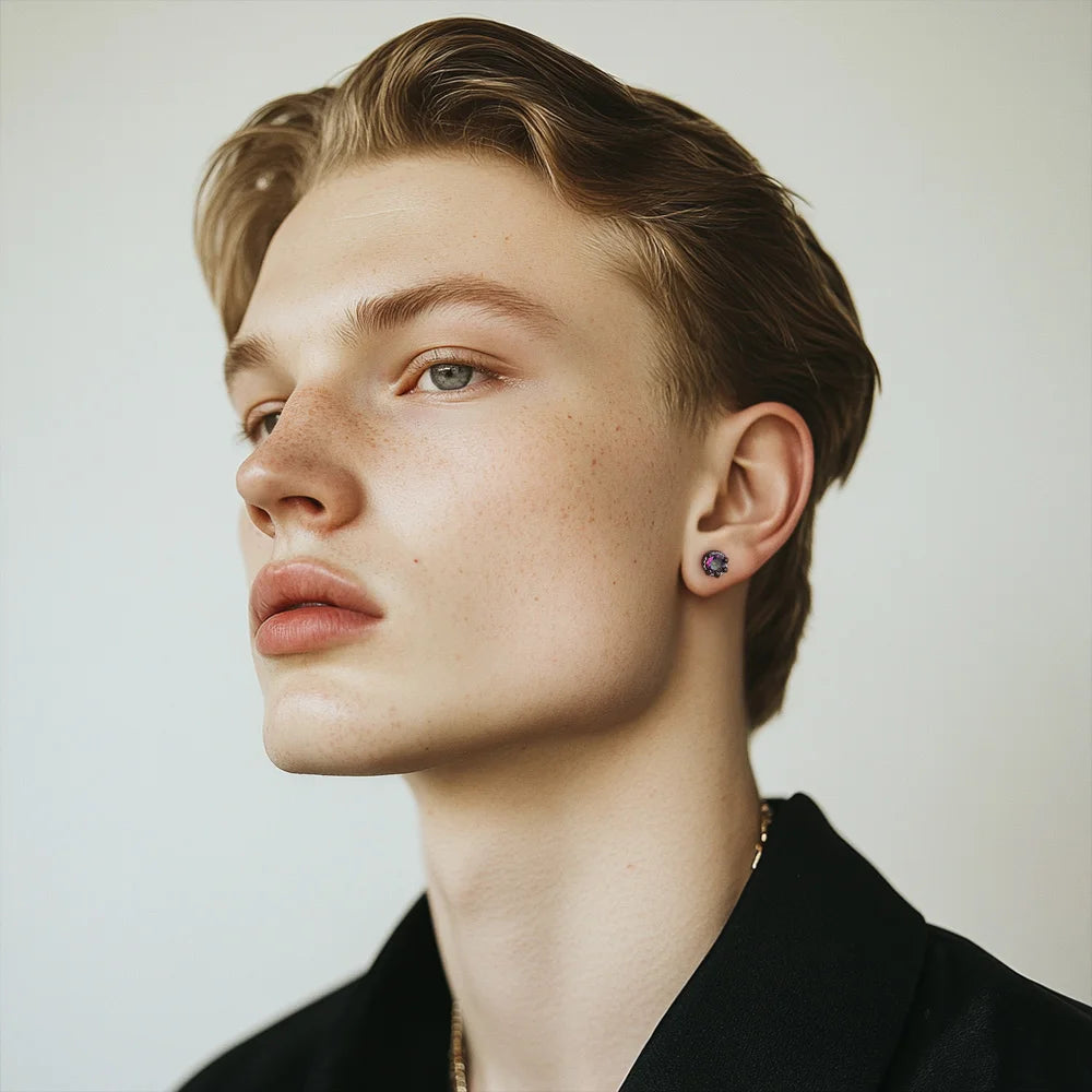 Emerald iridescent dragon claw magnetic stud earrings in black, side profile view on model wearing black shirt