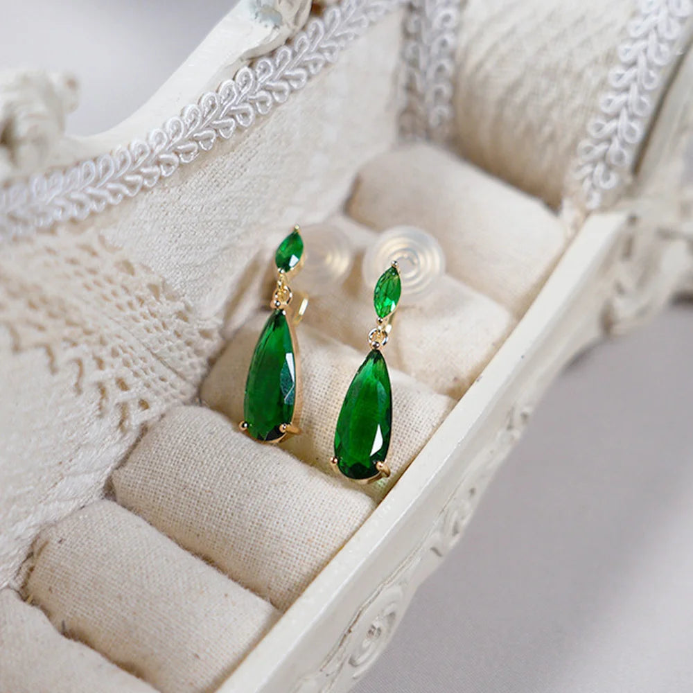 Elegant Emerald Gold Clip-On Earrings display