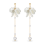 A pair of long dangle earrings featuring white flower-shaped charms, gold posts, and white pearl beads hanging from delicate gold chains