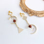 Geometric Harmony Dangle Clip-On Earrings in gold with red stone beads, front view on white background
