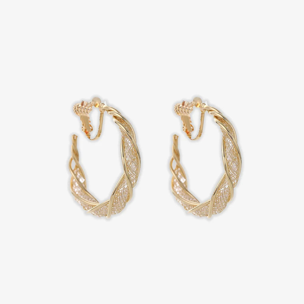 Discover the ultimate in elegance with our Glimmering Lattice Twist Clip-On Earrings in Gold with screw back closure. 