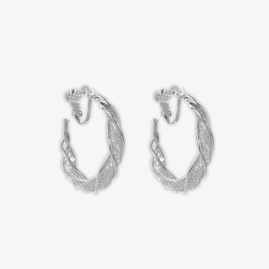 Turn heads with the cool elegance of our silver lattice twist earrings, adorned with sparkling glass stones for a dazzling effect that lights up any occasion.