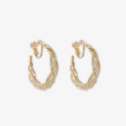 Discover the ultimate in elegance with our Glimmering Lattice Twist Clip-On Earrings in Gold with screw back closure. Perfect for those who love the luxurious look of gold without the need for pierced ears.