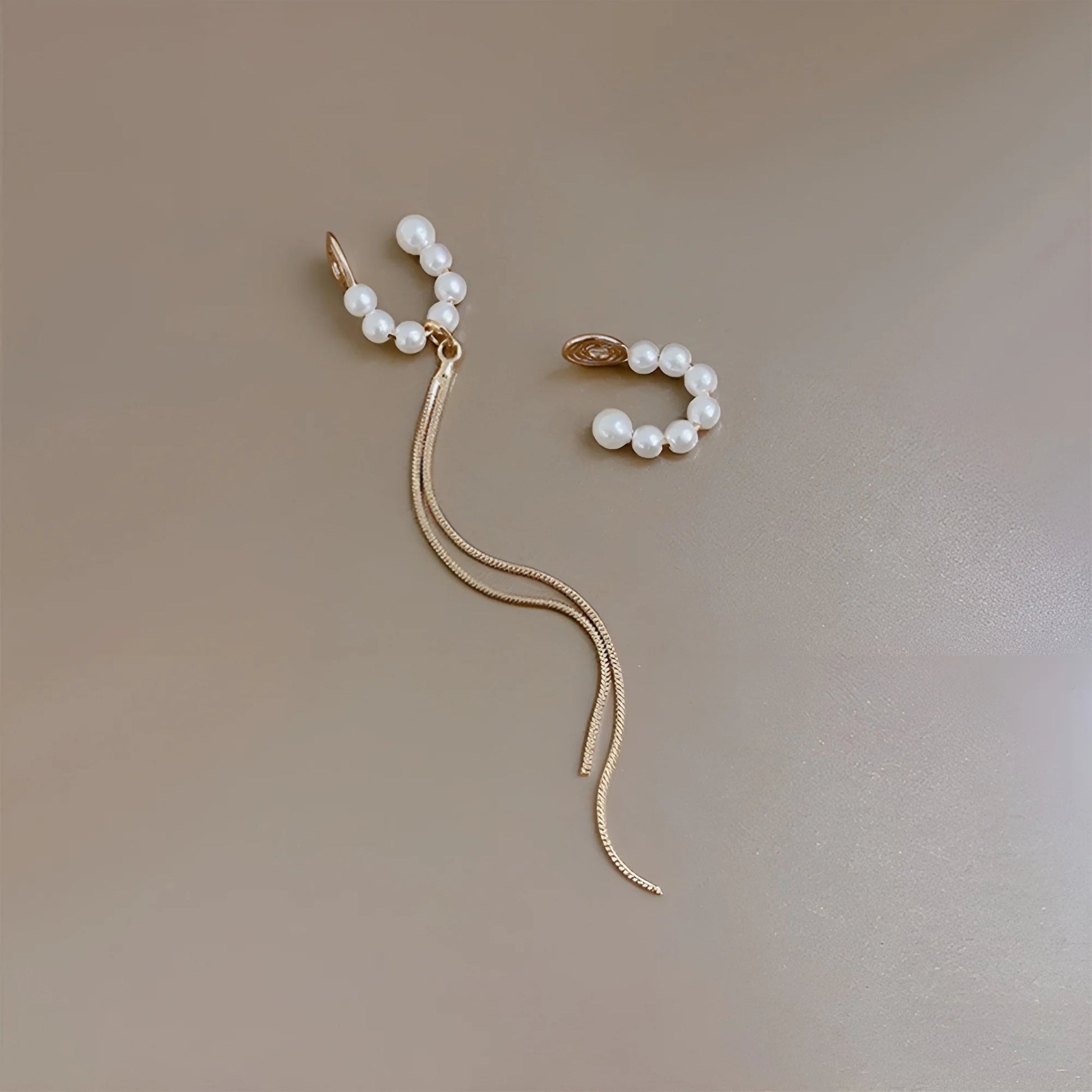 Versatile clip on pearl earrings set with one tassel cuff and one simple cuff, 95mm long.