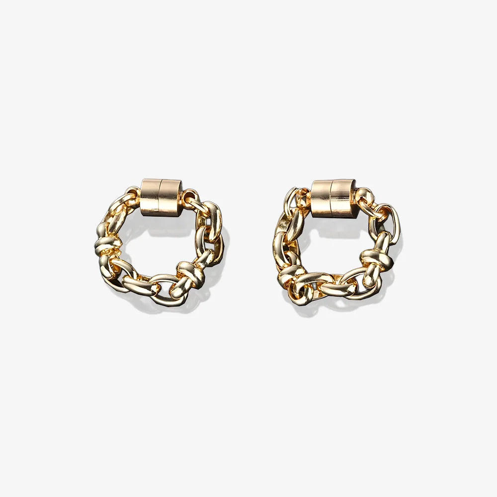 A pair of gold magnetic hoop earrings made from titanium steel.