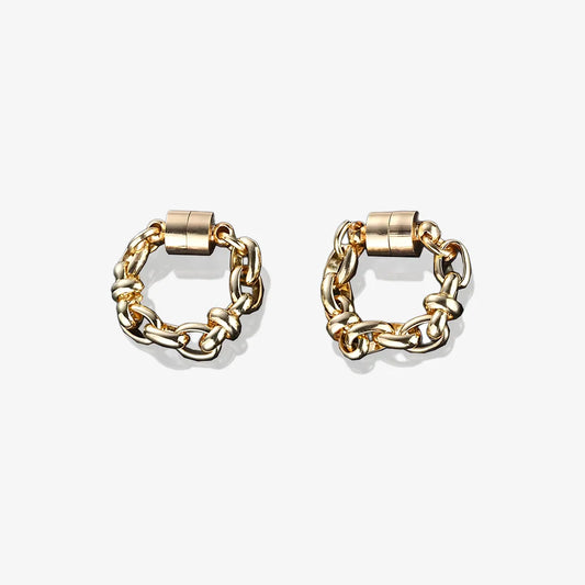 A pair of gold magnetic hoop earrings made from titanium steel.