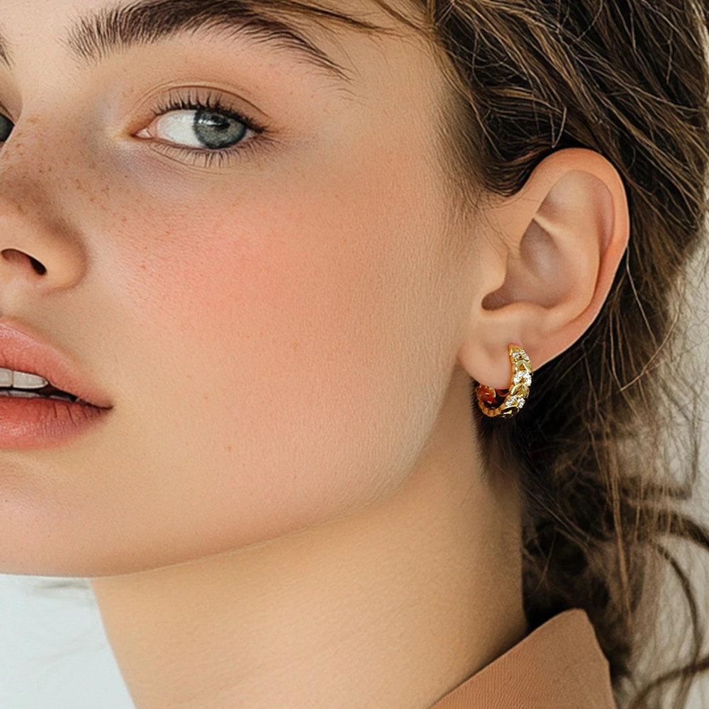 Gold chain zirconia clip-on hoop earrings side view worn on ear showcasing sparkle and design detail