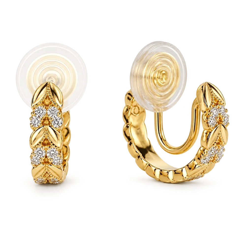 A pair of gold huggie hoop earrings with clear pavé diamond leaf motifs, shown from both front and side angles on a white background.