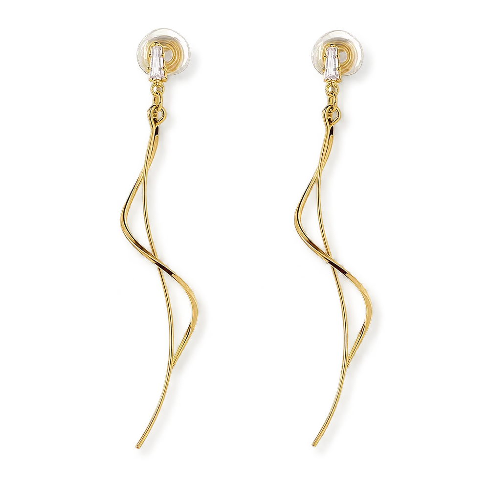 A pair of gold dangle earrings with a twisted, flowing wire design and clear crystal backings, shown on a solid white background.