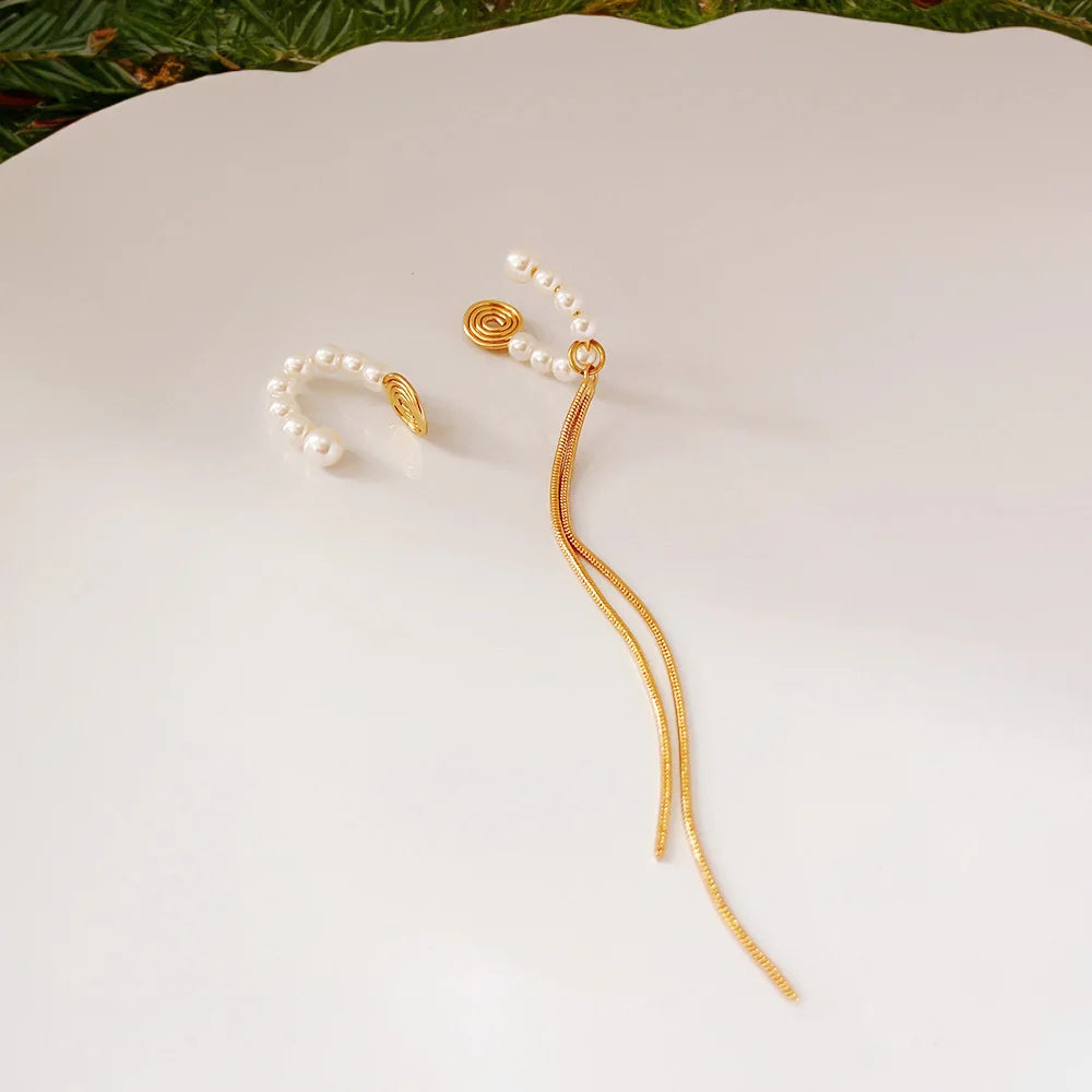 Asymmetric ear cuff for women with faux pearls and a delicate gold-plated tassel.