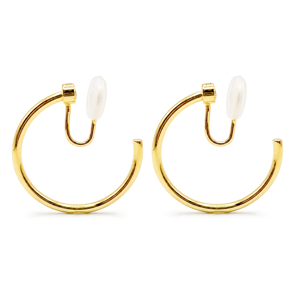 A pair of polished yellow gold hoop earrings with u-type closures, shown on a clean white background.