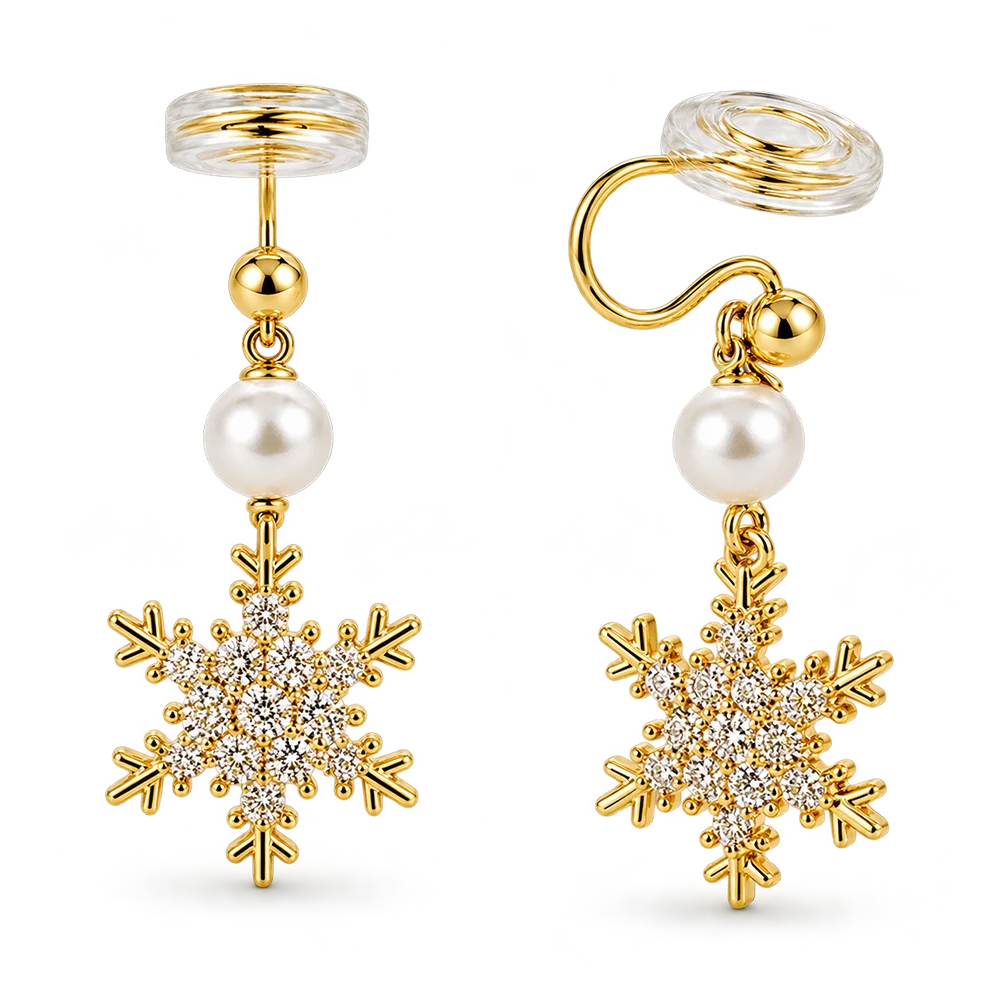 A pair of gold-toned dangle earrings with clear crystal snowflake charms, a white faux pearl, shown on a white background.