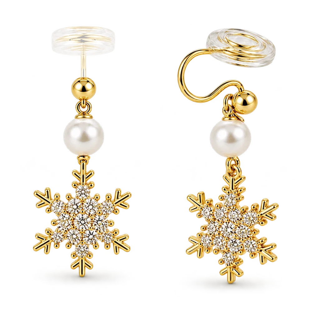 A pair of gold-toned dangle earrings with clear crystal snowflake charms, a white faux pearl, shown on a white background.