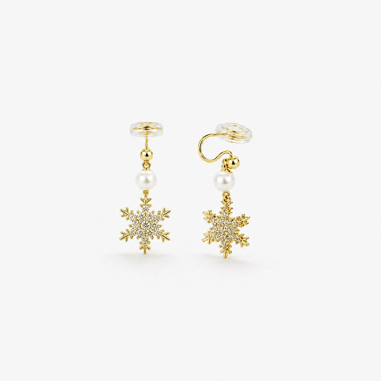 Gold snowflake zirconia clip-on earrings with pearl accents front view on white background