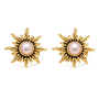 A pair of gold sunburst stud earrings with a round pale pink pearl in the center, set against a plain white background.