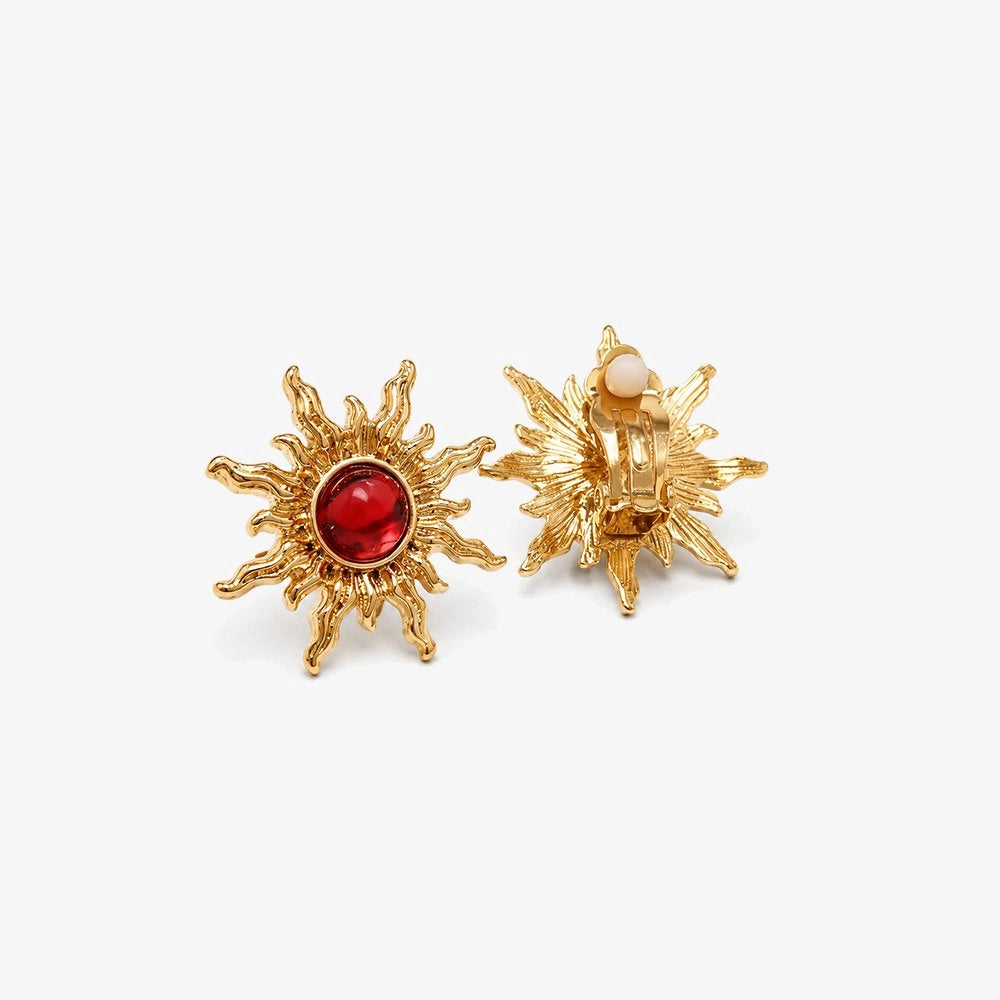 Gold Sun Clip-On Earrings with Ruby displayed on white background with ornate gold frame detail