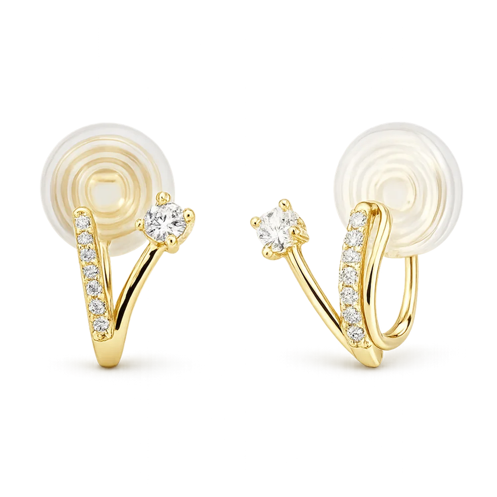 A pair of gold hoop earrings with clear gemstones, shown on a plain white background. Each earring features a curved gold band with a row of small clear stones and a larger central clear stone, attached to a flat circular white backing.