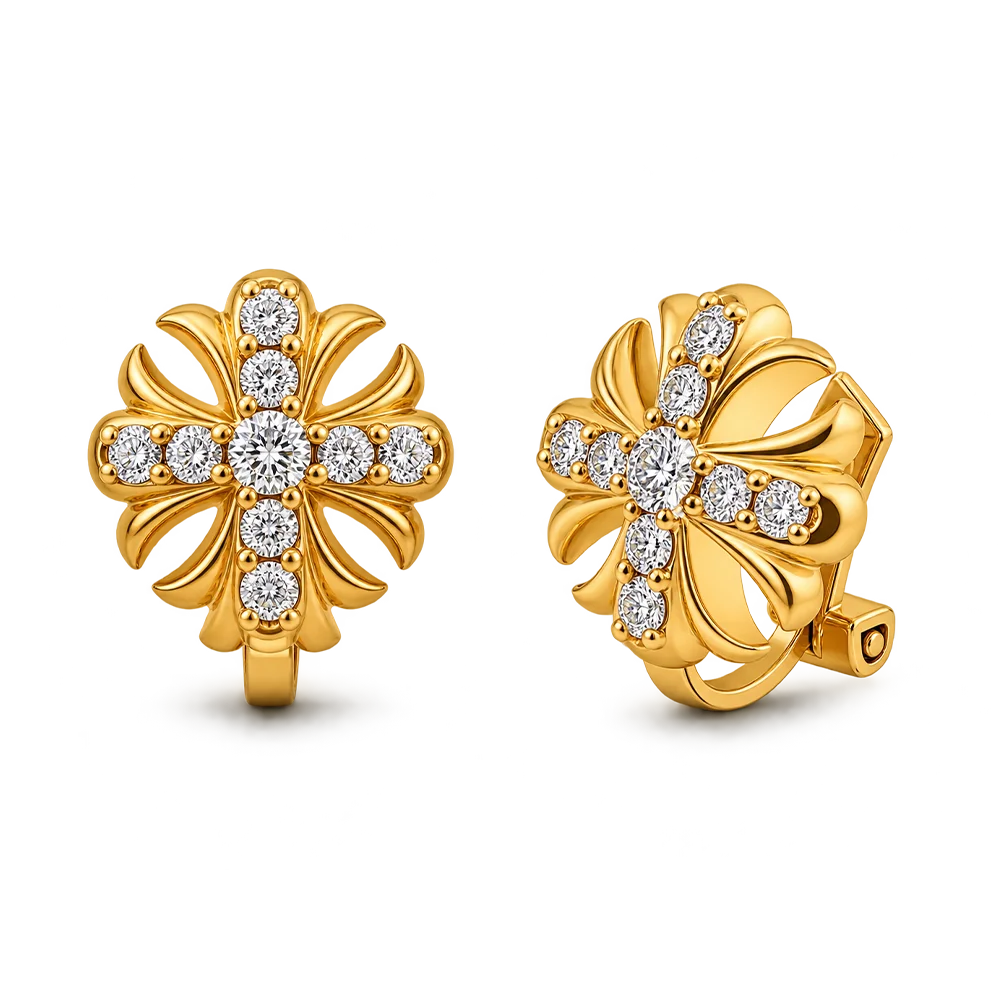 A pair of gold huggie hoop earrings with a floral design, set with clear round-cut gemstones, shown on a clean white background.