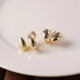 Front view of Dual Bean-Shaped Clip-On Earrings in white plate emphasizing their sleek and bold design.