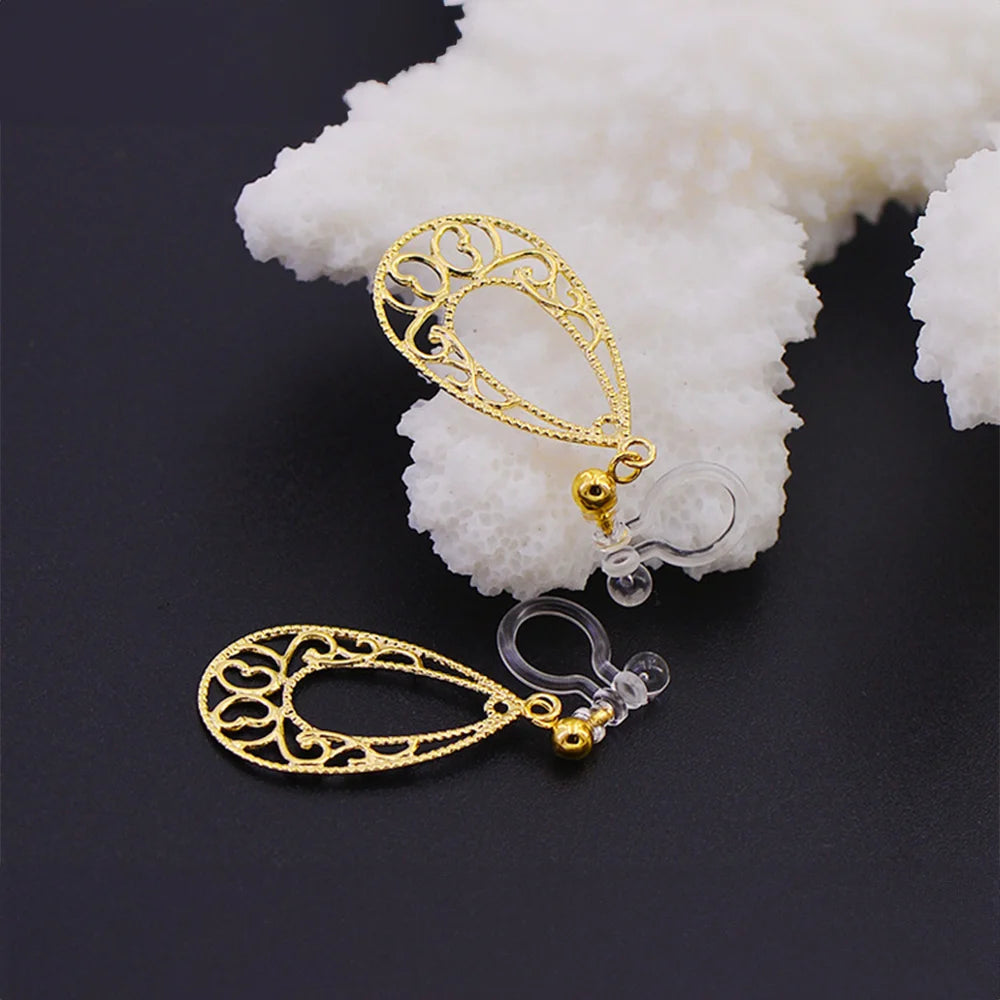 Elegant Golden Filigree Teardrop Clip-On Earrings for women, featuring an invisible clip for non-pierced ears.