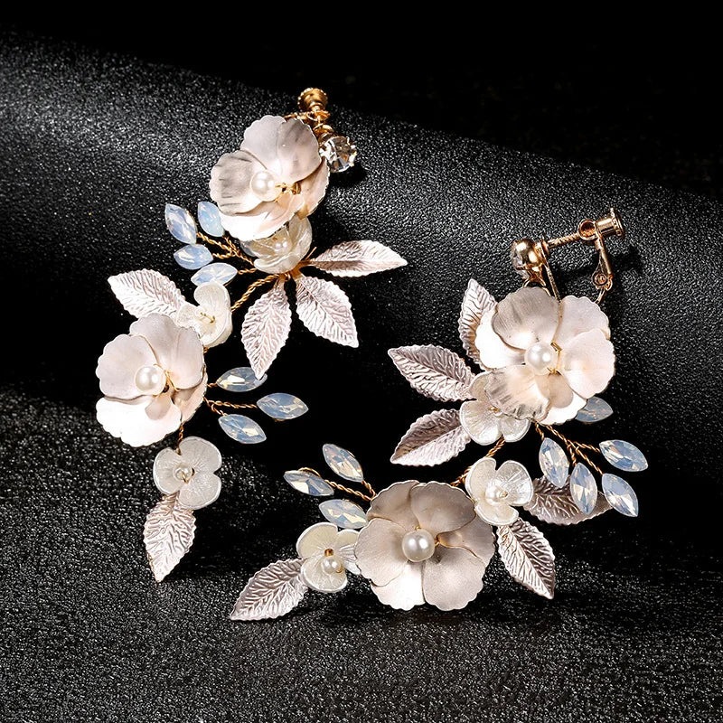 Handmade clip-on earrings for women, featuring golden leaves and blossoms.