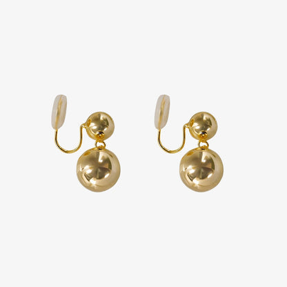 Front view of Golden Sphere Drop Clip-On Earrings showcasing polished gold spheres.