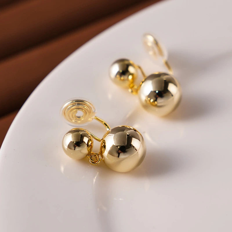 Close-up of the clip-on closure for Golden Sphere Drop Earrings, designed for non-pierced ears.