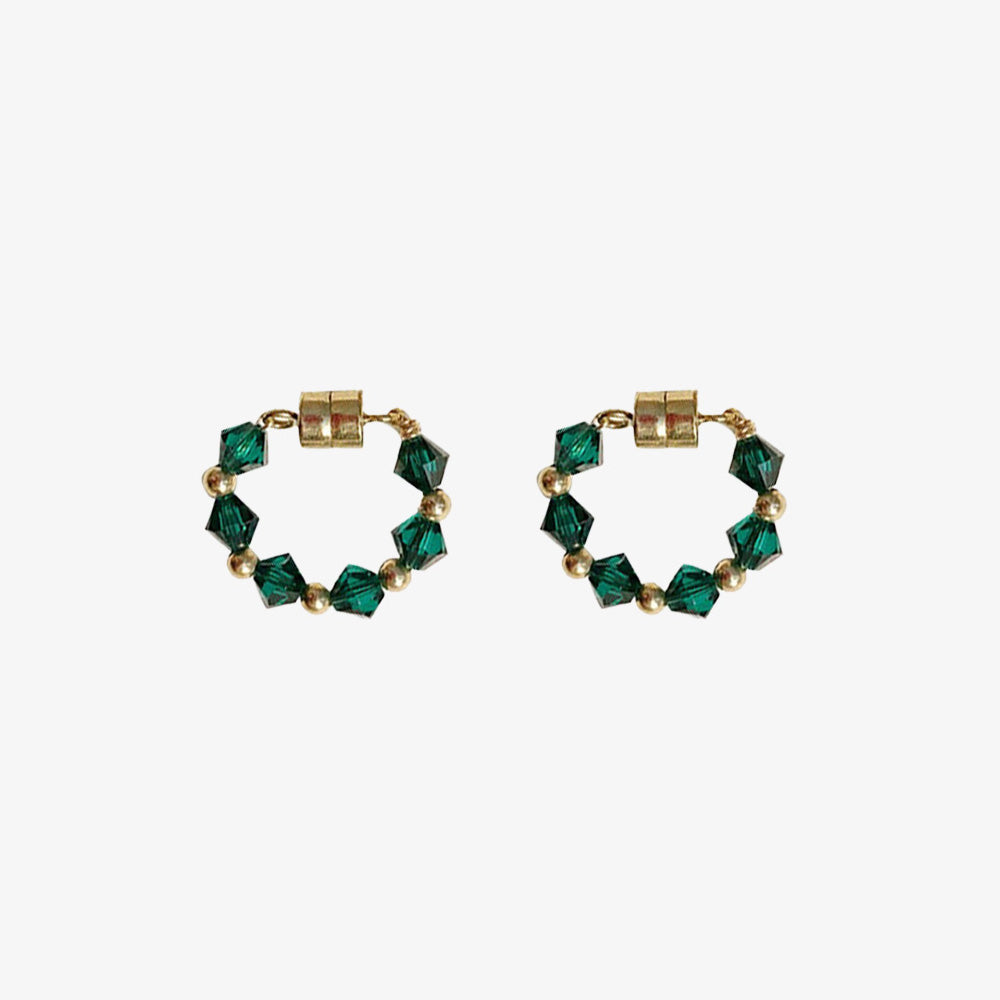 These magnetic earrings feature stunning green bicone crystals for a pop of color.