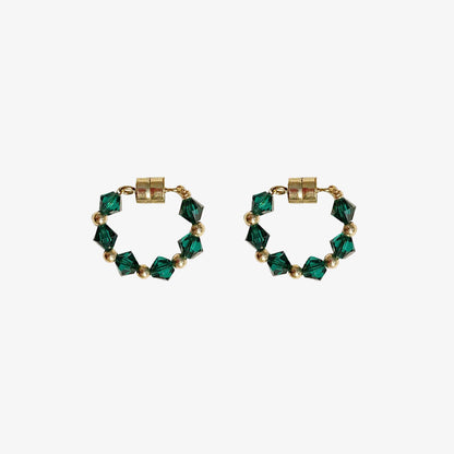 These magnetic earrings feature stunning green bicone crystals for a pop of color.