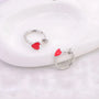 Women's fake earrings in silver with a charming heart design, perfect for everyday wear.