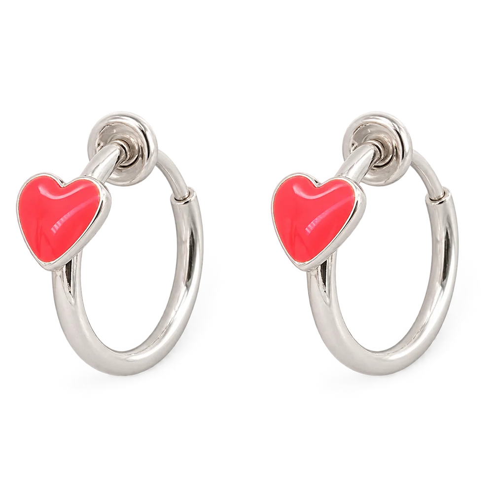 A pair of silver hoop earrings, each adorned with a small, glossy hot red heart charm, shown against a plain white background.