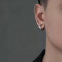 Hex Cut Clip-On Hoop Earrings in Silver side view on gray background