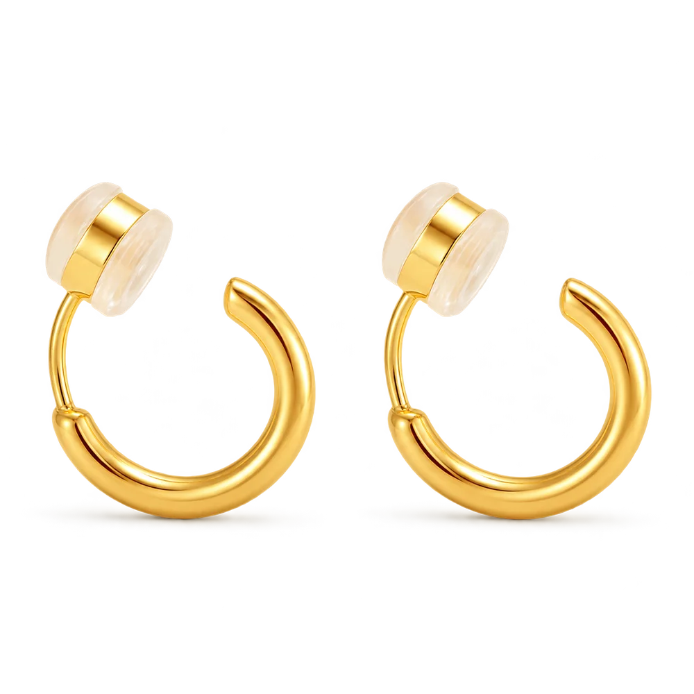 A pair of gold hoop clip on earrings, shown against a plain white background.