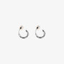 Pair of Huggie Hoop Clip-On Earrings in White Gold, showcasing white gold-plated copper and modern hoop design.