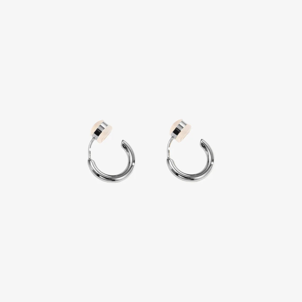 Pair of Huggie Hoop Clip-On Earrings in White Gold, showcasing white gold-plated copper and modern hoop design.