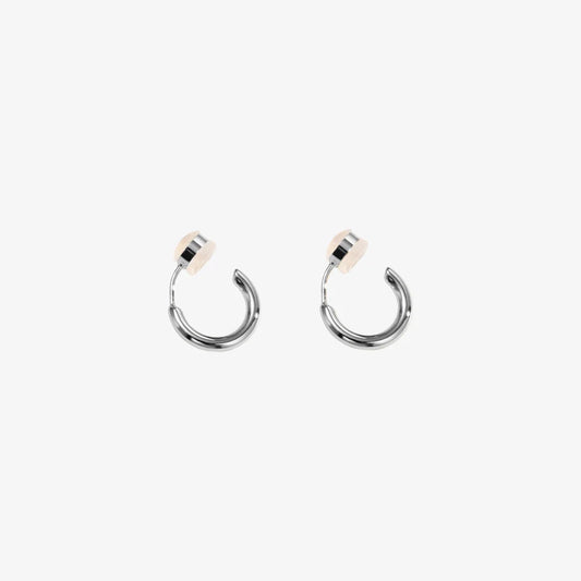 Pair of Huggie Hoop Clip-On Earrings in White Gold, showcasing white gold-plated copper and modern hoop design.