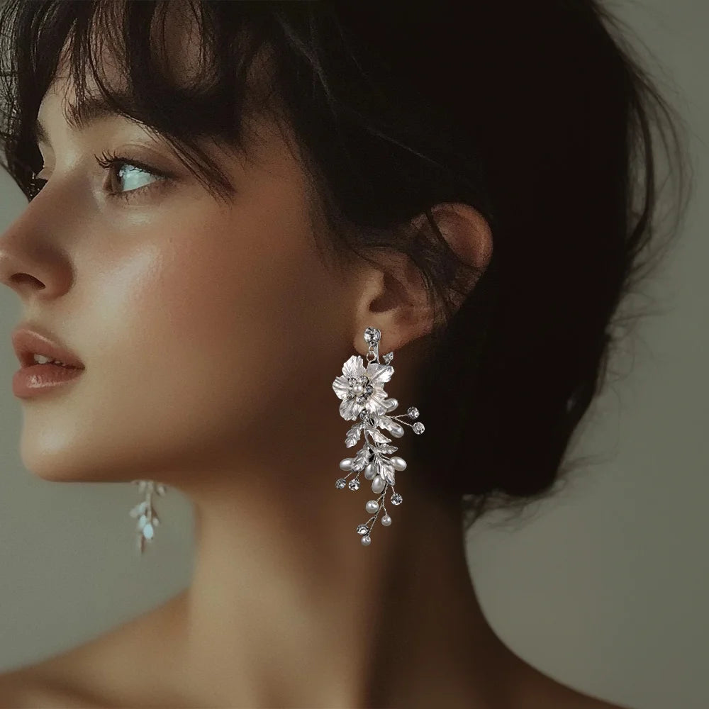 Model wearing Ivory Bloom Pearl Clip-On Earrings, perfect for weddings and proms.