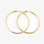 Gold large hoop clip-on earrings front view on white background
