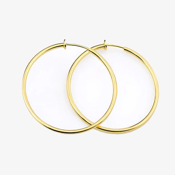 Gold large hoop clip-on earrings front view on white background