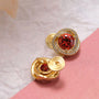 Golden Elegance Trio Clip-On Earring Set featuring red gemstone studs with diamond halos and gold hoops on pink and white background