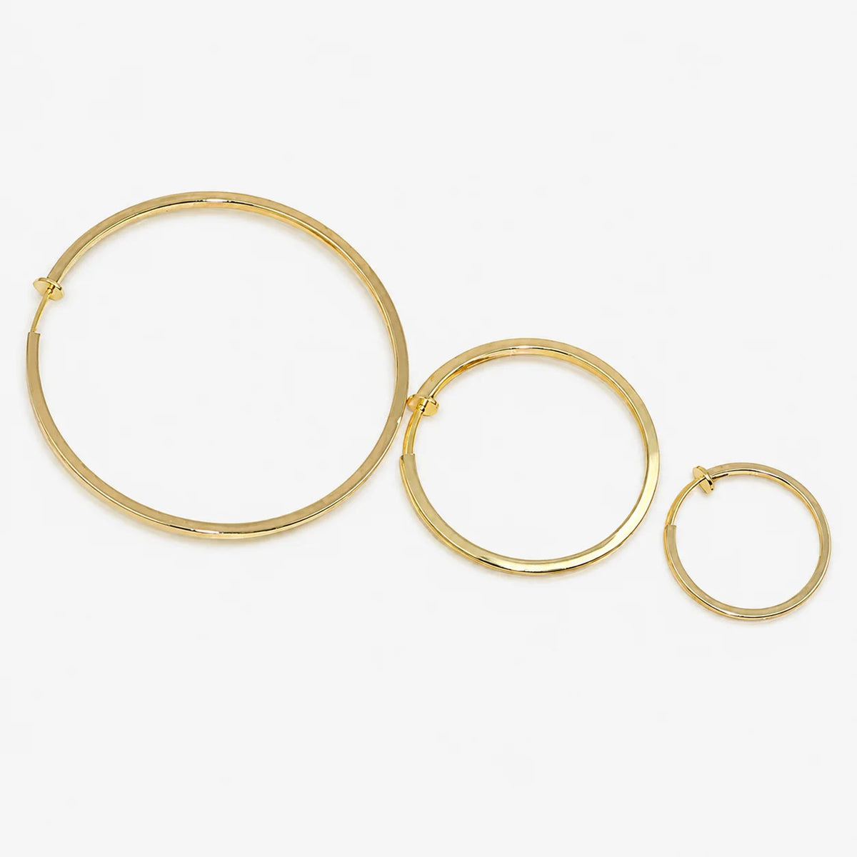 Gold square tube clip-on hoop earrings in three sizes displayed on white background