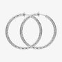 Large twisted textured silver hoop clip-on earrings front view on white background