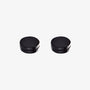 A pair of matte black round magnetic stud earrings for men, shown on a clean, white background.