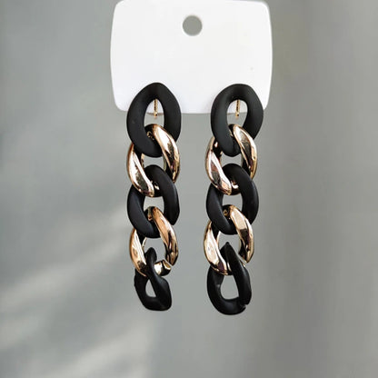 Matte Black & Gold Intertwined Chain Clip-On Earrings display