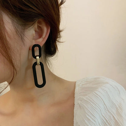 Matte Black & Gold Linear Loop Clip-On Earrings model