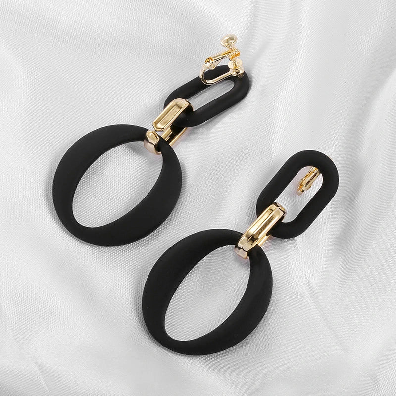 Matte Black & Gold Oval Link Clip-On Earrings display