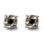 A pair of silver-toned square stud earrings with a central round black gemstone, photographed on a clean white background.