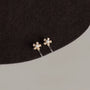 Mini Pearl Flower Invisible Clip-On Stud Earrings gold tone front view on neutral background