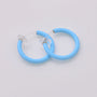 Blue mini glow clip-on hoop earrings front view on white background